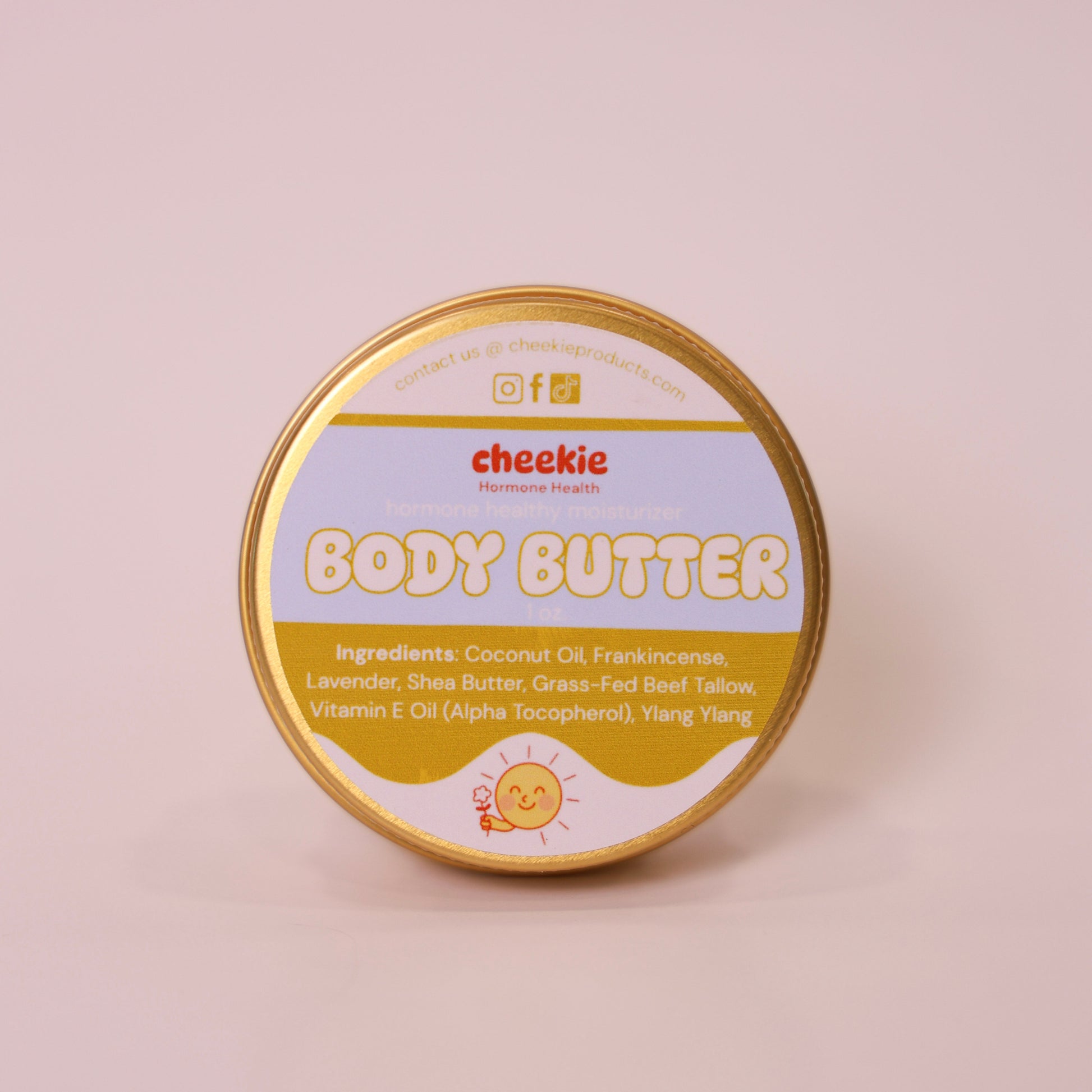 Tin of Cheekie body butter on a beige background
